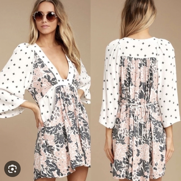 Free People Dresses & Skirts - Free People Tallulah White Print Mini Dress features a floral pattern